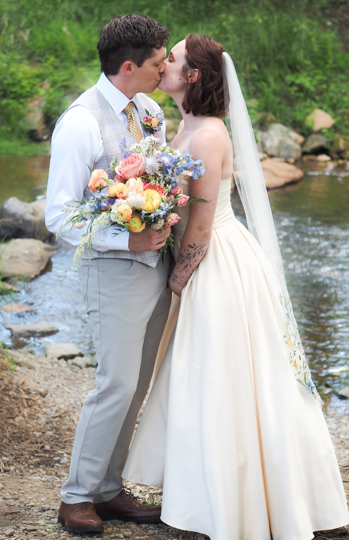 Asheville NC wedding photography – bride with colorful bouquet outdoor portrait